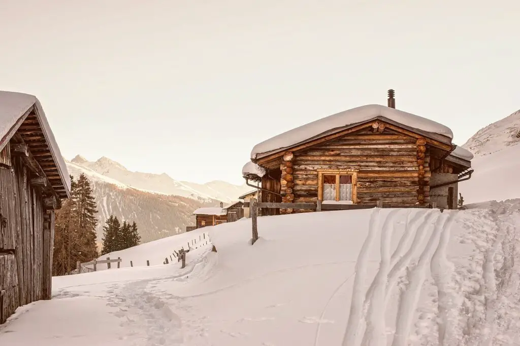 Log cabin in winter snow